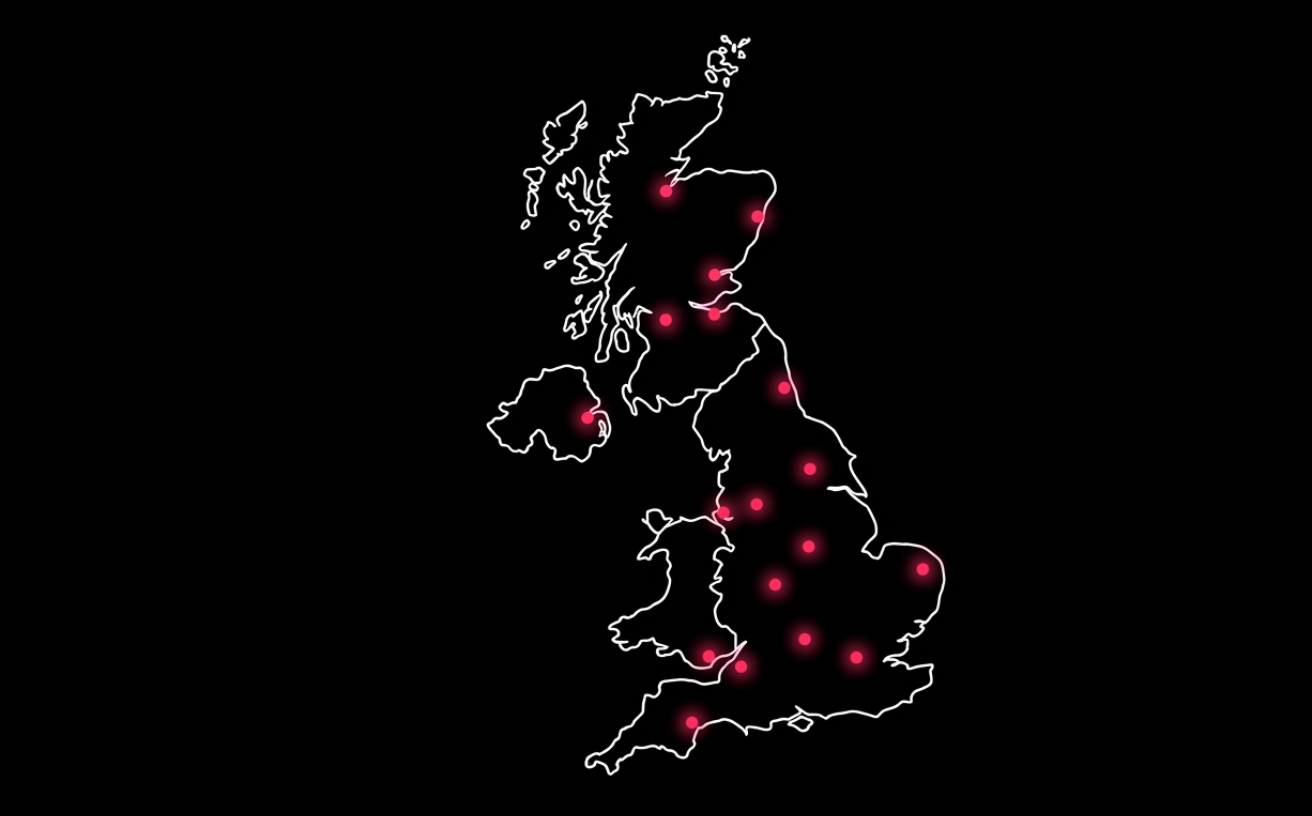 Map of the UK with crimson dots marking installer locations